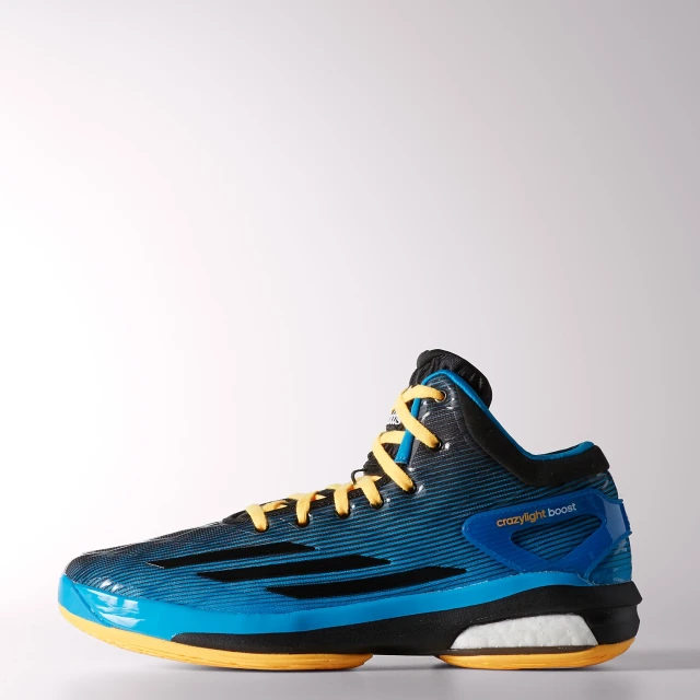 a blue and yellow basketball shoe with yellow laces on the sole