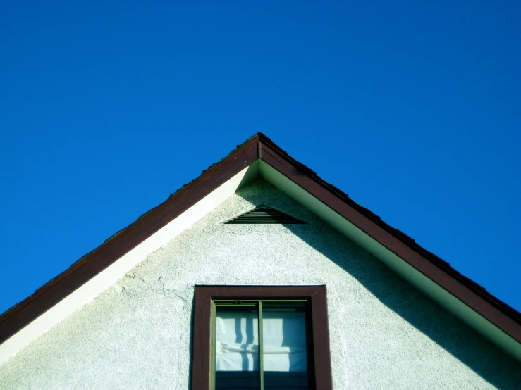 the roof is white and has a window in it