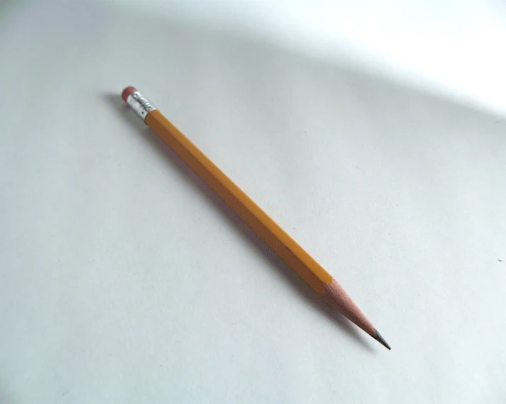 a pencil lying on its side and looking up