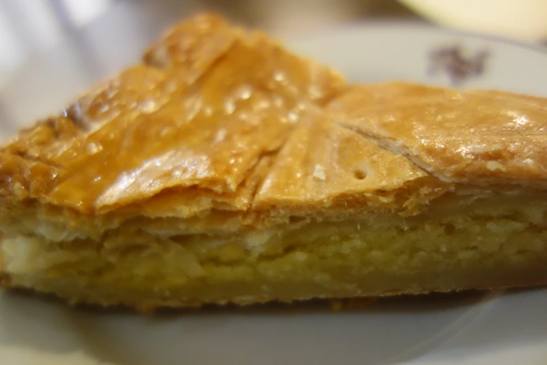 the pie is sitting on the plate with no crust