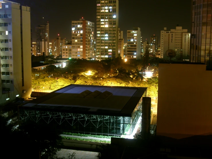 a large building on the side of a city at night