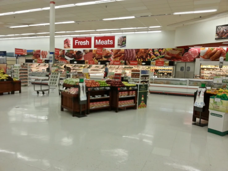 a large store with some shelves on the second floor