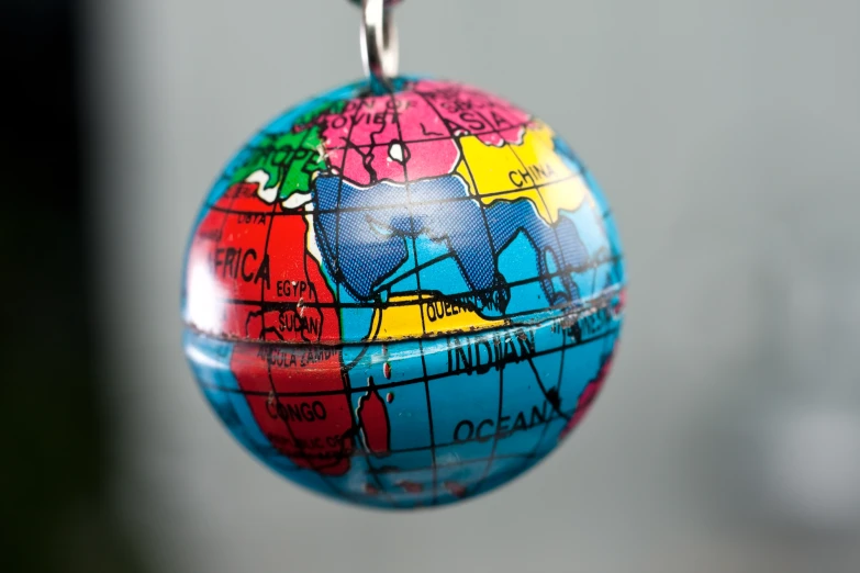 a globe that has been hanging on a chain