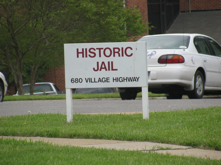 a sign is shown in front of a car