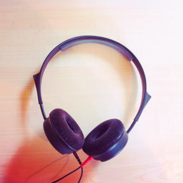 a pair of headphones sitting on top of a table