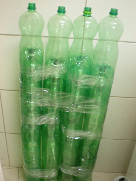 large plastic bottles are stacked on top of each other