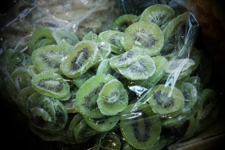 a bunch of green bananas sitting on top of a counter