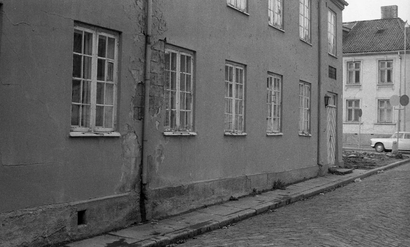 black and white pograph of street with old buildings