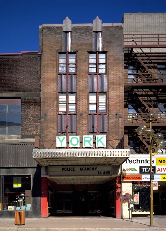 a tall building with a sign for new york police academy