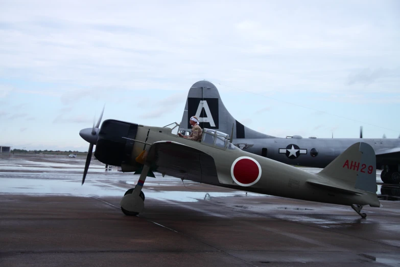 a world war ii aircraft sitting on a runway