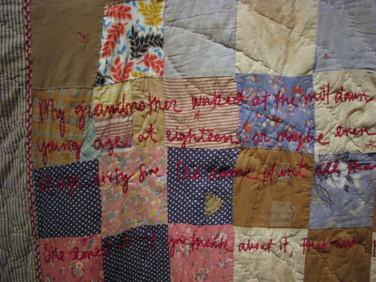 there is a patchwork quilt with words and words