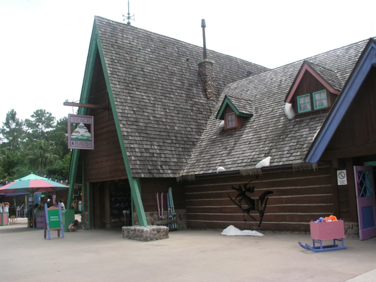 a colorful building with three green and white triangles on the top