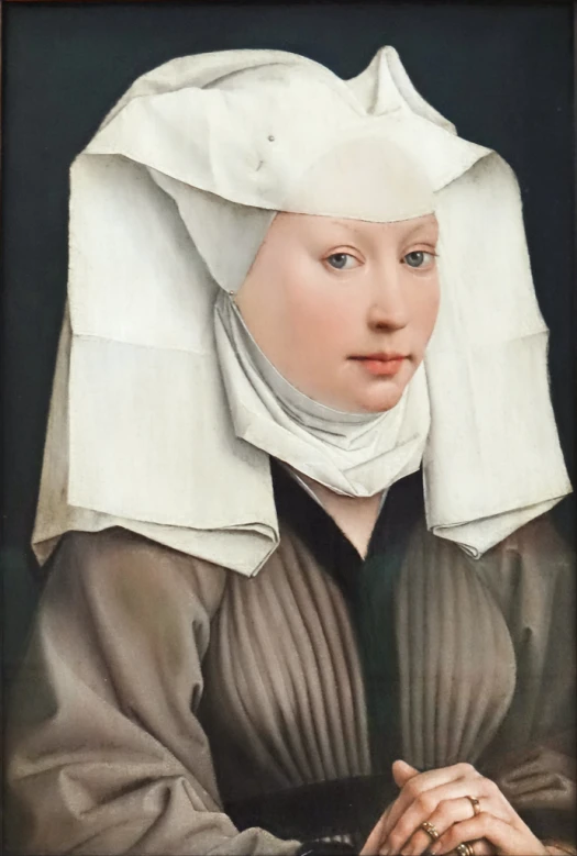 a woman with a white veil on her head