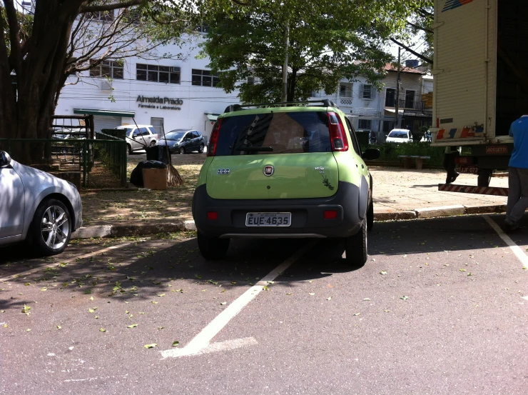 a car parked at a park bench by itself