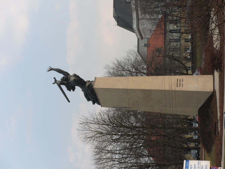 a statue on a long block of concrete