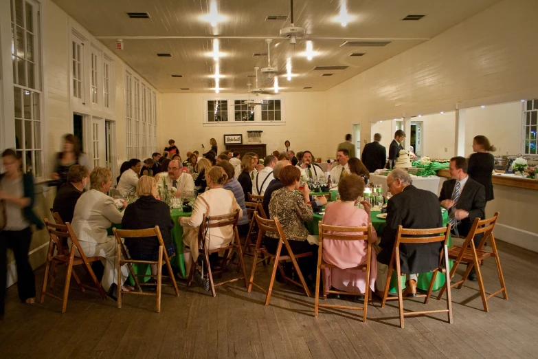 a large gathering of people at tables