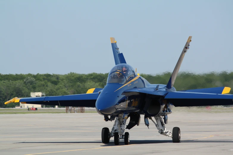 a fighter jet is sitting on the runway