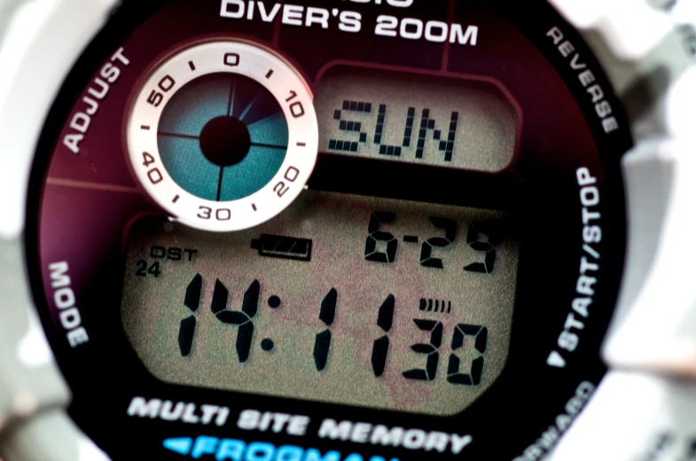 a digital watch with the time displayed by a red and white watch