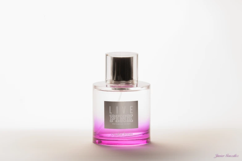 an empty perfume bottle sitting on a table