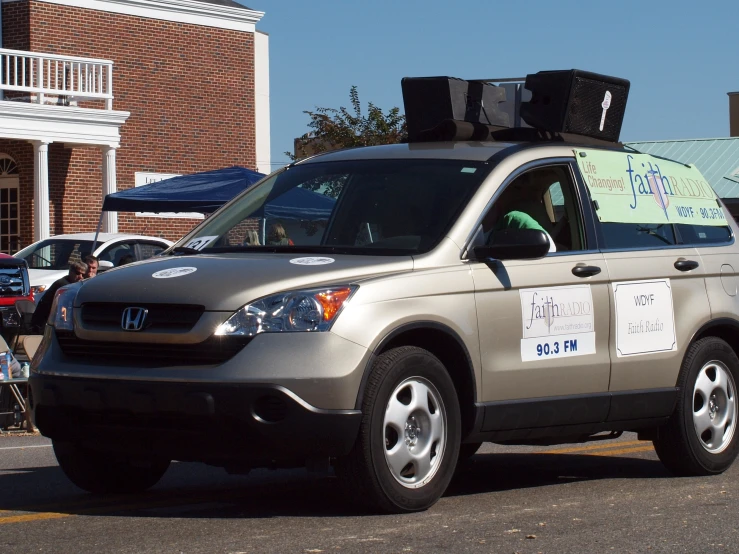 there is a car that has two boxes on the roof