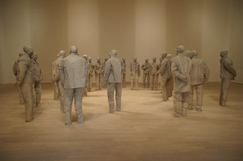 a group of people standing on a wooden floor