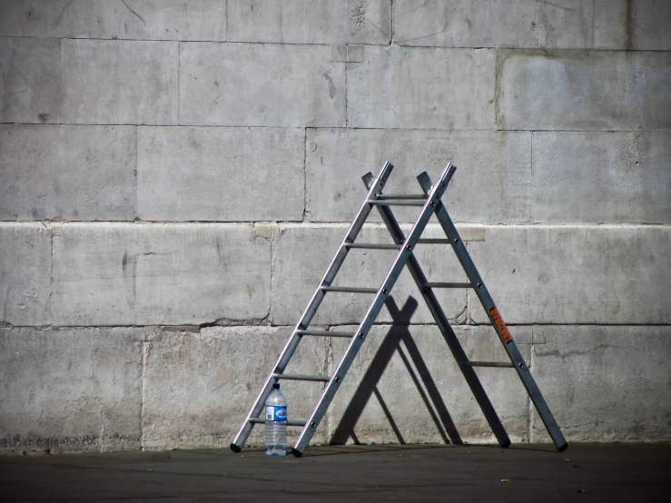 a ladder that is leaning against a wall