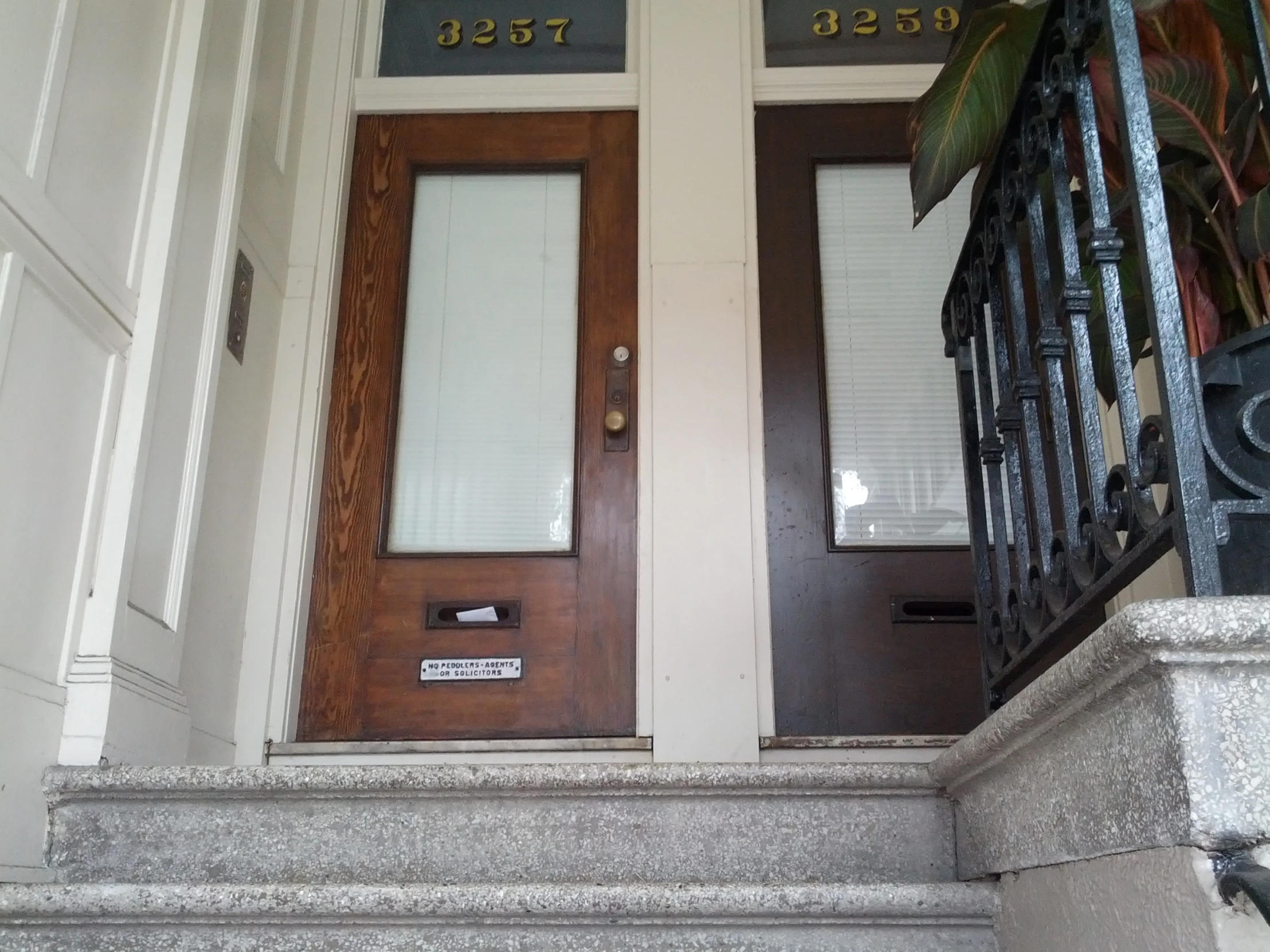 a pair of doors with signs on the sides of the doors