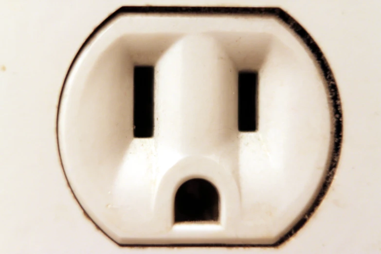 a close up of an electrical outlet in a wall