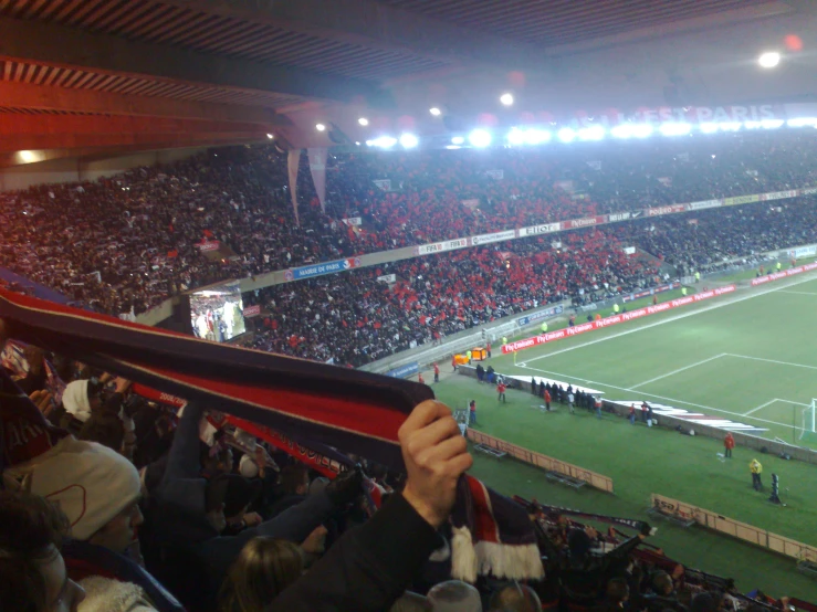 fans at a soccer game holding their jerseys