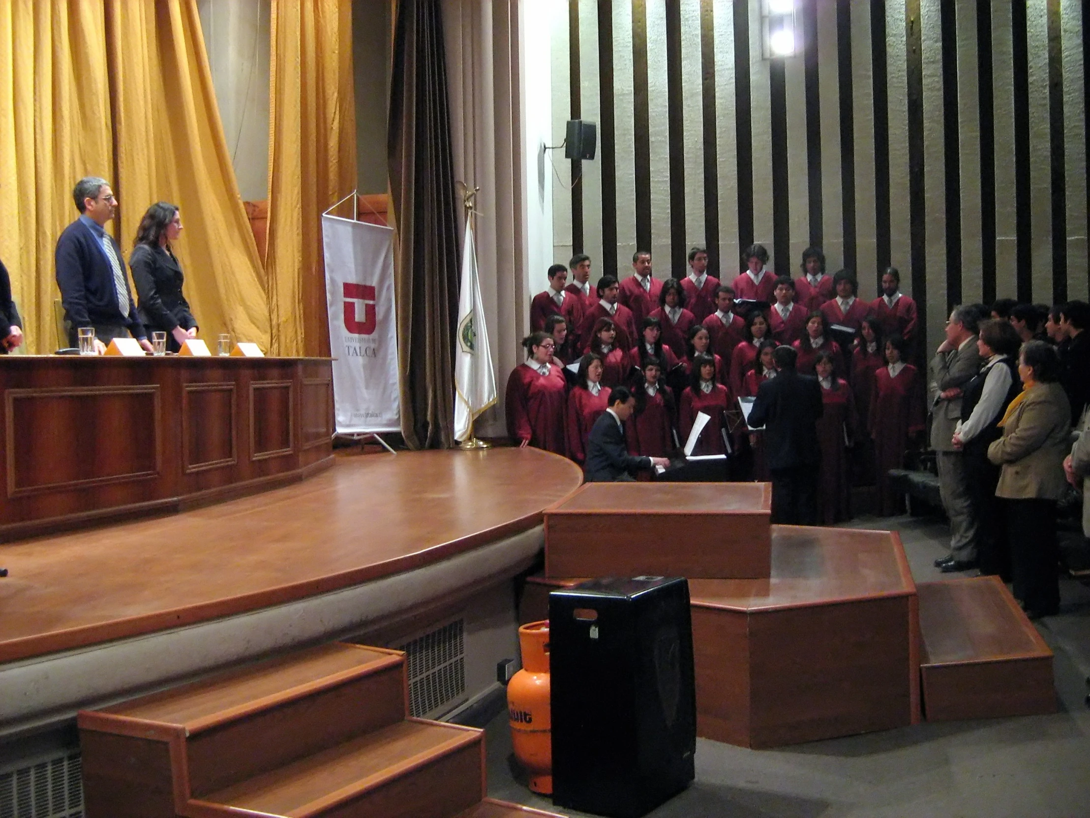 a group of people standing in front of microphones and podiums