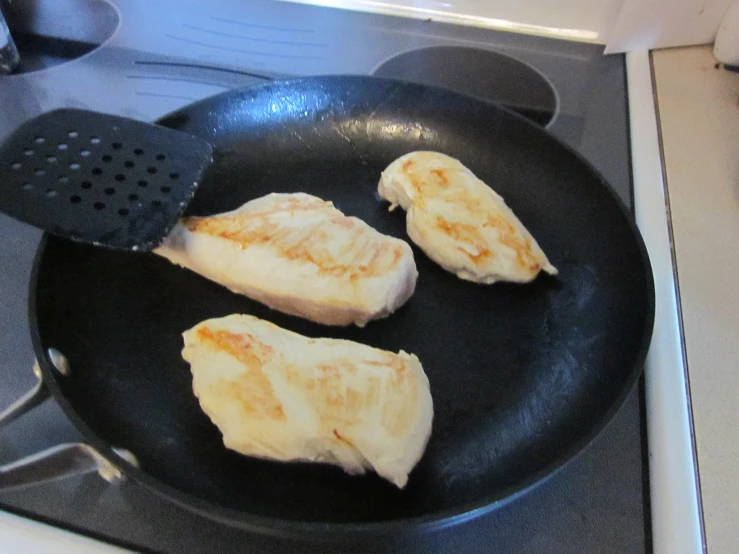 some food is being cooked in a black set