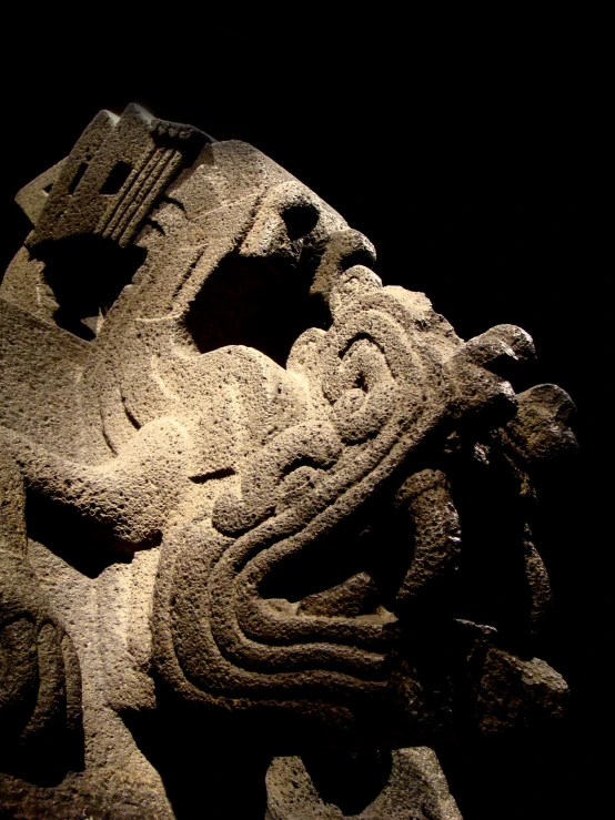 a stone statue of a lion is in front of the camera