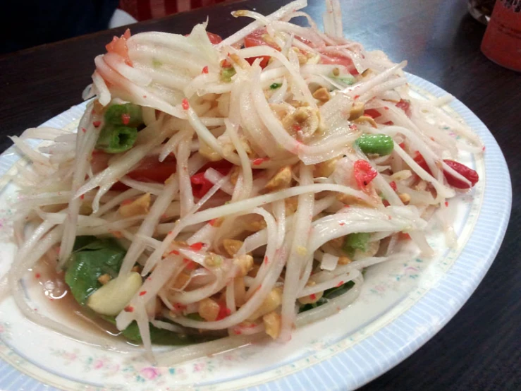 a salad on a plate with a fork