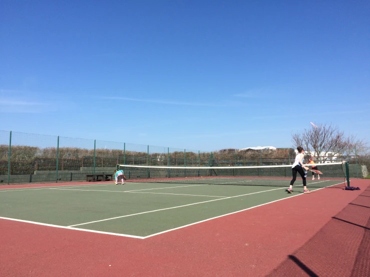 a man is playing tennis on the court