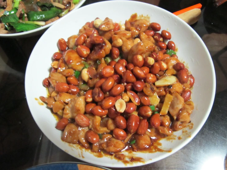 a plate with food, consisting of beans and meats