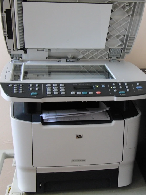 a printer with a printer tray next to it