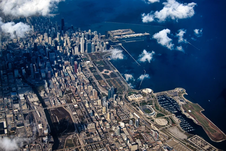 an aerial view of the ocean and a city