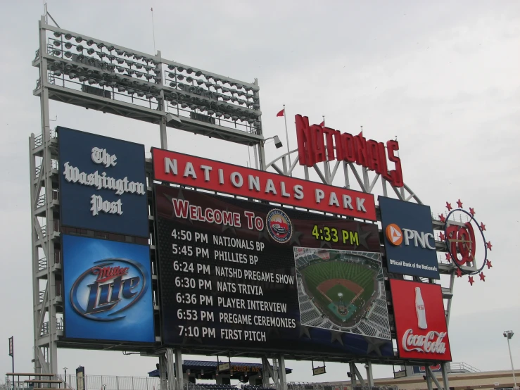 a baseball field with signs and lights