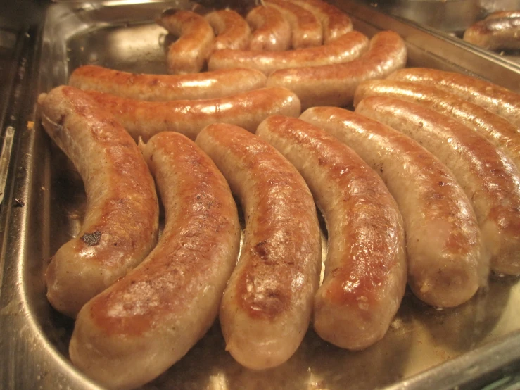 there are sausages that are in the pan together