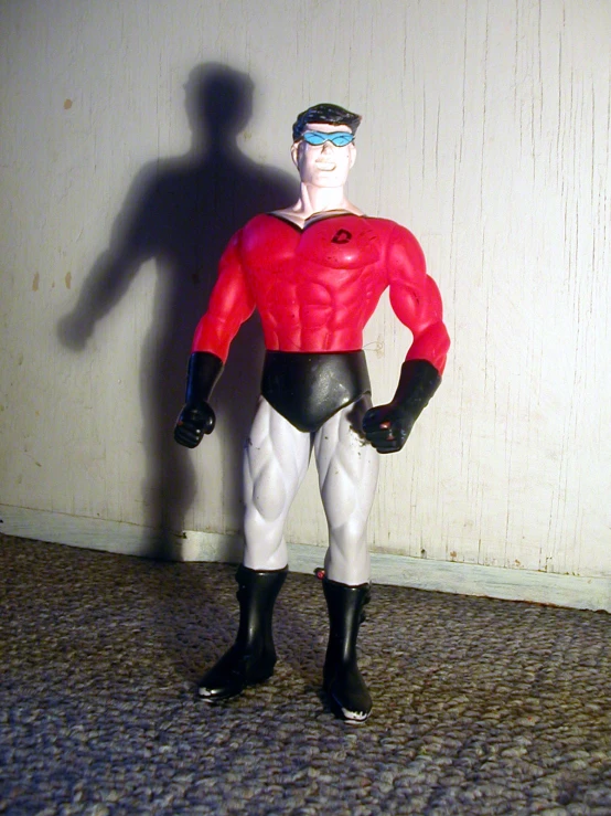a man figure dressed as a human being standing in the floor