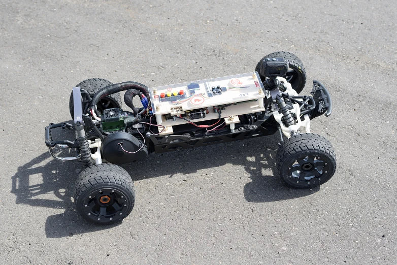 an assembled toy car sits on the ground