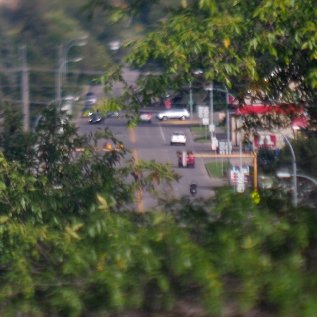 a town view from the window of an apartment building