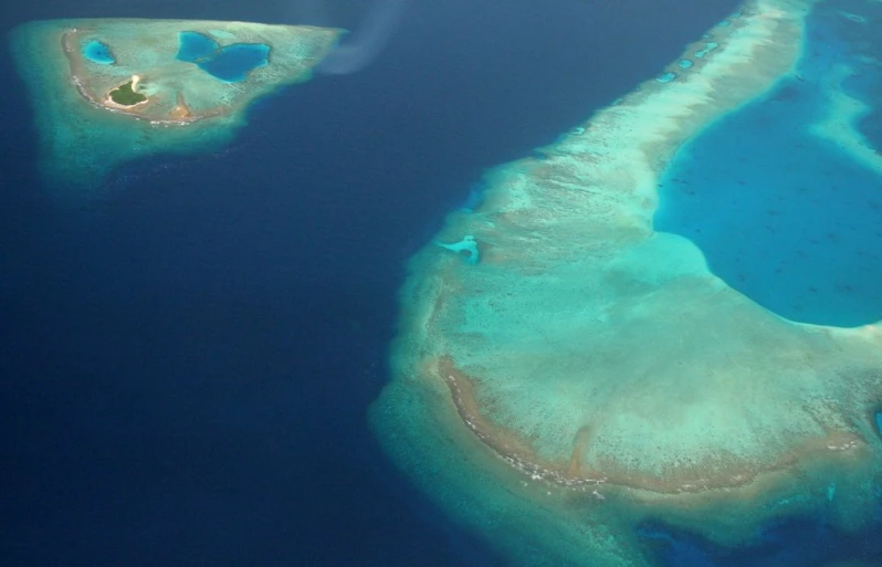 an island in the middle of water and smaller islands