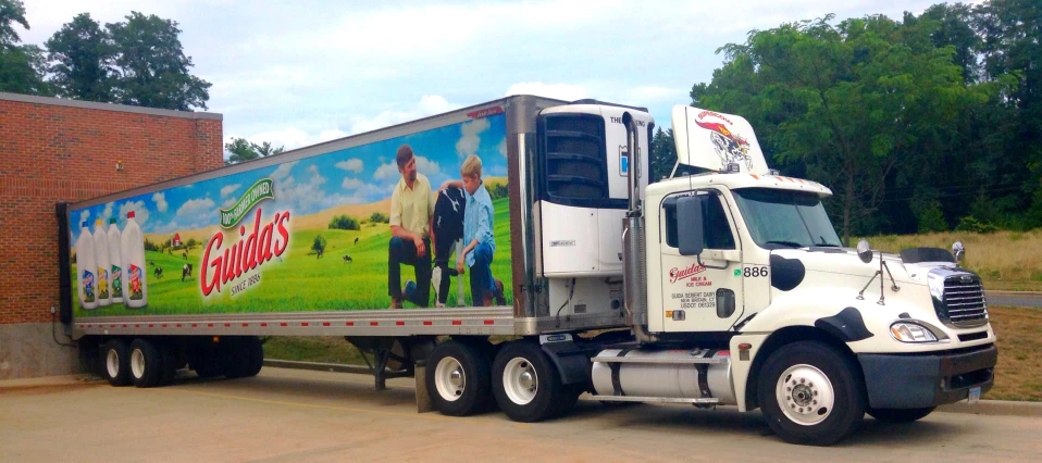 a semi truck with an ad on it