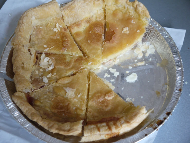 pie slices with some burnt in them in a tin plate