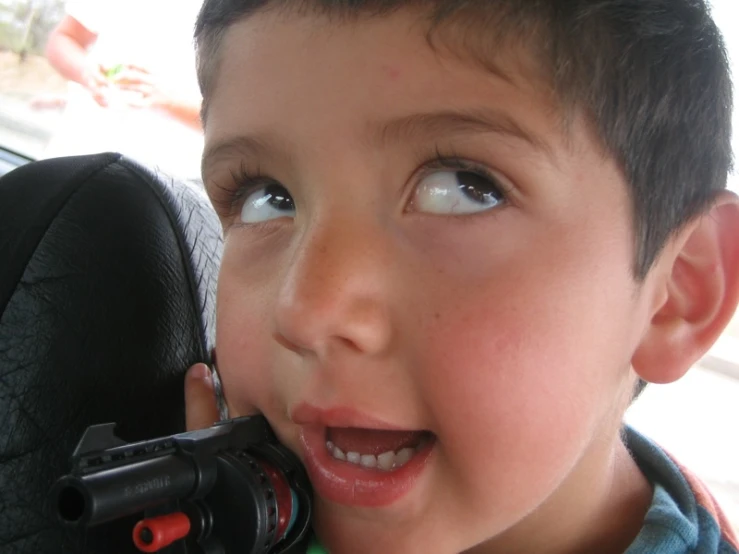 a  driving with his camera in his hand