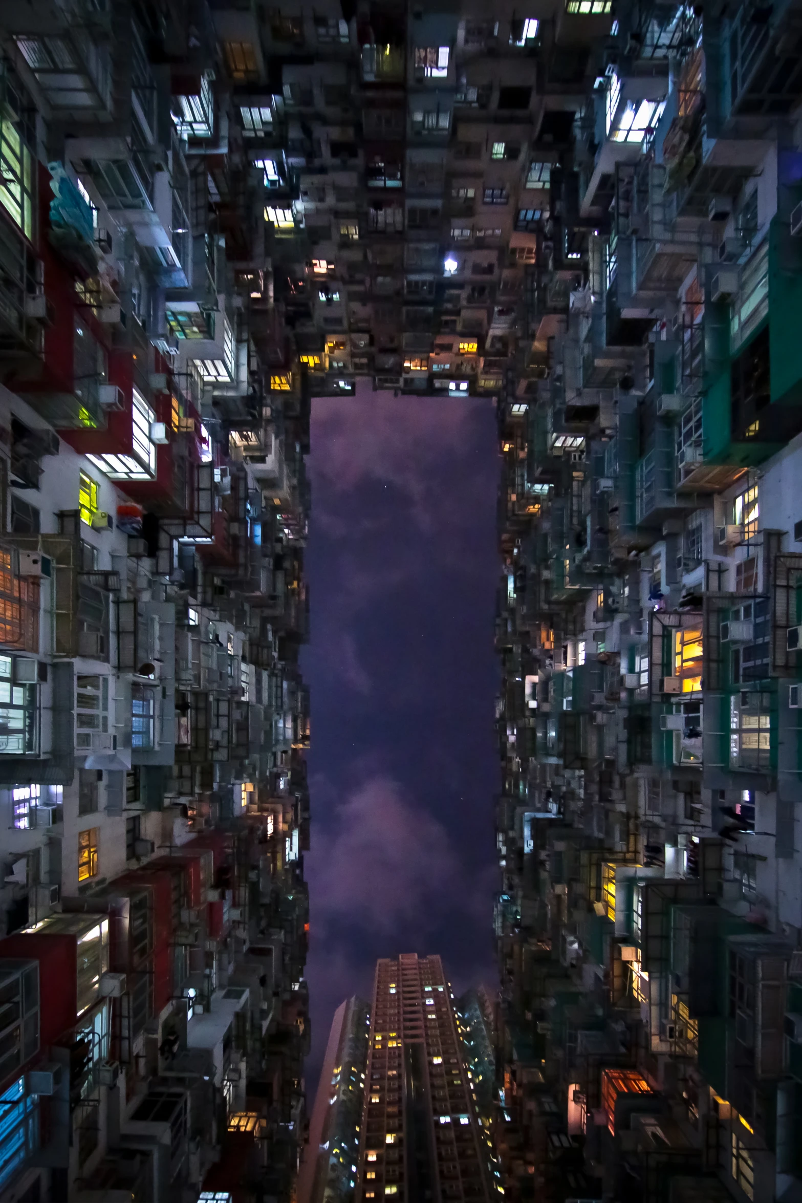 night time view of a city with skyscrs and buildings