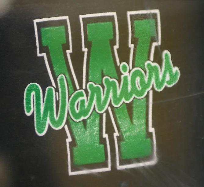 the word warrios painted on the side of a building