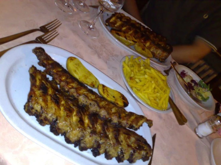 a table with a white plate and several food items