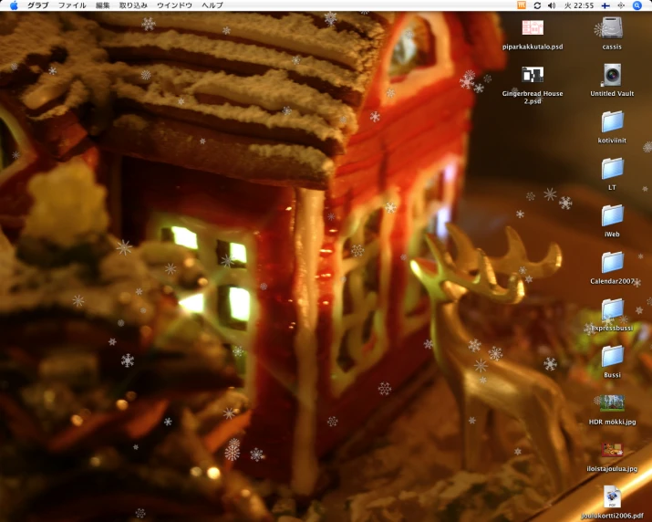 a close up of a gingerbread house and figurines